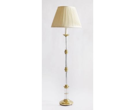 A modern brass standard lamp,with a sectional ribbed glass column, with shade,175cm high overall
