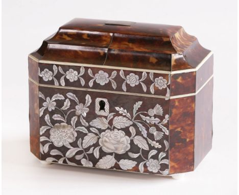 A tortoiseshell tea caddy,first half of the 19th century, the interior with twin compartments below a cushion moulded top, ov