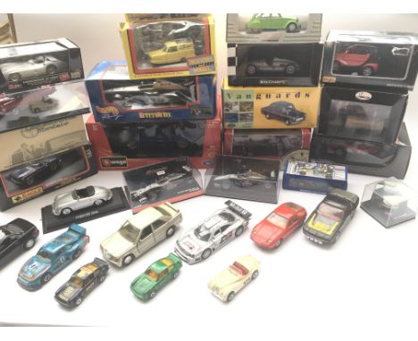 A Box containing a Collection of boxed Diecast Vehicles including Vanguard. Burago. Corgi and some loose.
