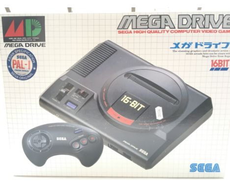 An Asian Pal-import Boxed Sega Drive 16bit. 6 Games and a Arcade Power Stick.