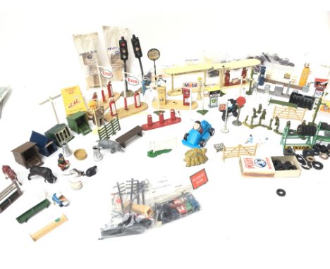 A Collection of Various Signs/ Fuel Pumps. Bagged Cases/ Barrels. Farm Yard animals. Etc. Including Dinky.