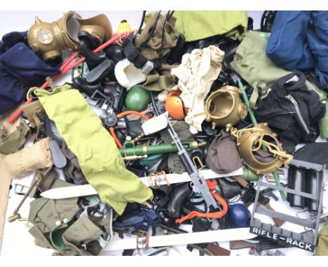 A Large Collection of Action Man Accessories. Including Guns.Boots and Uniform.