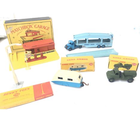 A Boxed Matchbox Showroom and Service Station. A Dinky Pullmore Car Transporter (not Boxed). A Dinky Caravan #190.A Army Wate
