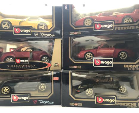 A Box Containing 6 X Burago Vehicles Boxed 1/18 Scale. Including Porsche. Dodge. Etc.