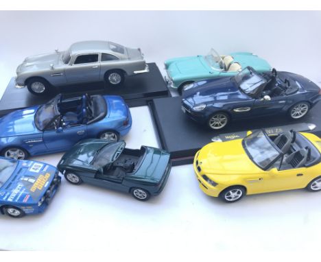 A Collection of 1:18 Scale Vehicles and others including Maisto.