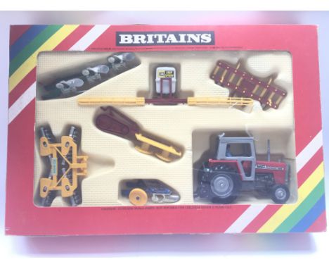 A Boxed Britain’s Massey-Ferguson Tractor and Farm Implements set. #9592.