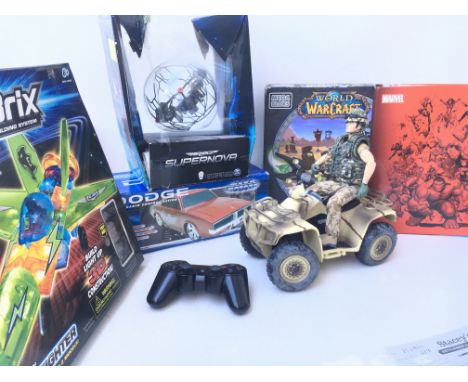 A Box Containing  HM Forces Solider on Bike. Marvel Fact File. War Craft. Air hogs Super Nova. A Mega Motors R/C Dodge and a 