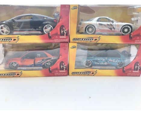 4 X Jada Toys Boxed Cars Scale 1:24 including Scion tC. A Mazda RX-7 FD35. A Subaru and a Mitsubishi.