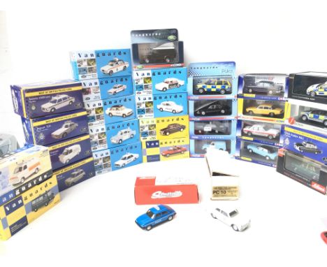 A BoxContaining  A Collection of Atlas. Vanguards. Corgi etc Die Cast Police Cars and others.