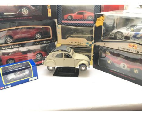 A Box Containing a Collection of Boxed Diecast including Maisto Mercedes CLK-GTR. A Maisto Chrysler PT Cruiser etc. ( one loo