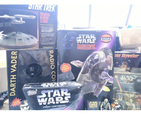 A Collection of Star Wars Merchandise including a Boxed Slave One. R/C Darth Vader etc. And a Star Trek Talking alarm clock.