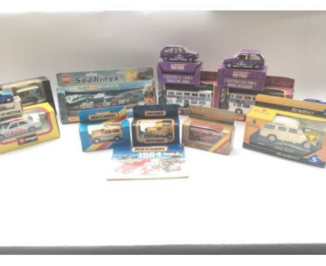 A Collection of Boxed Matchbox. corgi. Solido. Etc. With a Matchbox 1984 catalog.