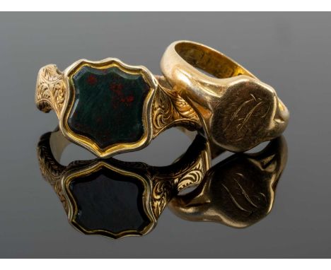 TWO YELLOW METAL RINGS comprising 18ct gold signet ring engraved with initials, together with yellow metal bloodstone shield 