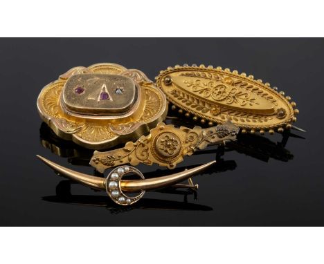FOUR VICTORIAN BAR BROOCHES, including large locket brooch set with rubies and a diamond chip, crescent brooch set with seed 