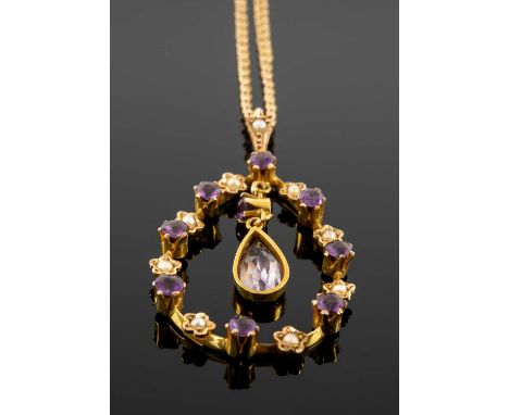 15CT GOLD AMETHYST & SEED PEARL PENDANT, with central drop pear shaped amethyst, on yellow metal chainProvenance: private col