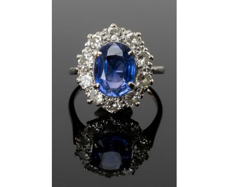 SAPPHIRE & DIAMOND CLUSTER RING, centre stone 8 x 10mm, within ten 0.1ct diamonds, unmarked white metal setting and shank, to