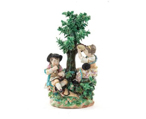 EARLY 19TH C. DERBY PORCELAIN MUSICIANS GROUP, modelled as 2 children playing oboe and tambourine beside a tree, 24cms hProve