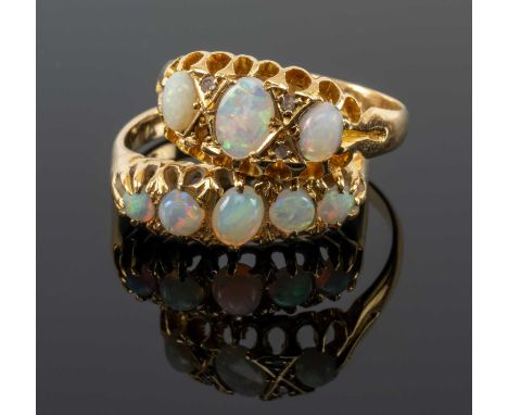 TWO 18CT GOLD OPAL RINGS, one with three graduated oval opals the other with five, 6.6gms gross (2)Provenance: private collec