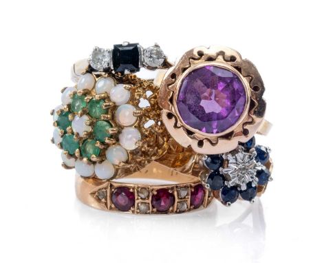 FIVE DRESS RINGS, comprising sapphire flower cluster ring, three stone diamond and sapphire ring, Egyptian yellow metal ameth