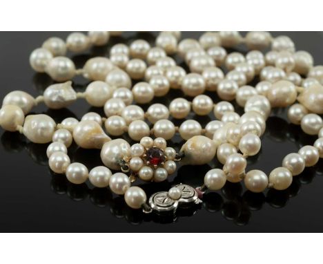 TWO SINGLE STRAND PEARL NECKLACES, comprising necklace of graduated pearls from 9-5mm, clasp stamped '750', 57cms long, 28g; 