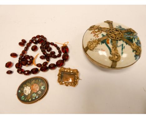 Faceted red amber beads, micro-mosaic panel brooch and a Georgian memorial brooch with glazed centre compartment, and a Satsu