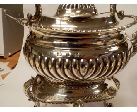 Hallmark silver four-piece tea service, comprising silver tea kettle on stand, tea pot, sugar basin and milk jug of half flut