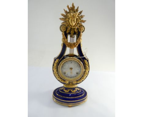 A decorative French Lyre shaped clock enamelled in royal blue enamel with sunburst panel mounts and diamante Bessel height 39