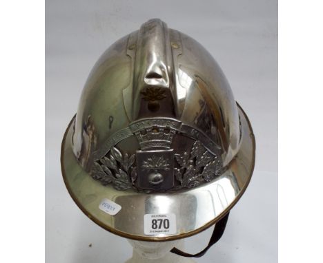 French fireman's helmet in brass and chrome, complete with its original interior leather liner and leather strap 