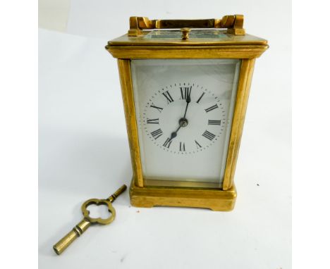 Brass case carriage clock with key      Enamel fractured on dial, clock running & striking currently