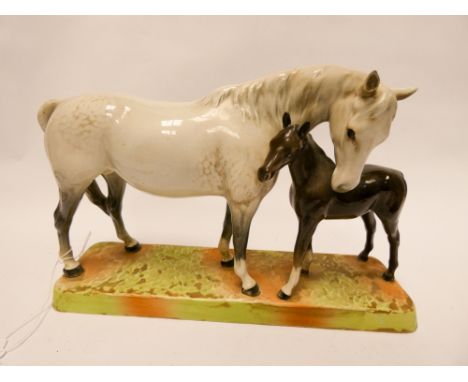 Beswick figure group of dapple grey mare and foal on a rectangular plinth. Numbered on base 1811     No obvious sign of damag