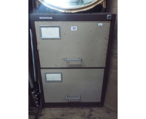 An old 2 drawer filing cabinet containing a quantity of tools and a rake, brush, tree loppers etc 