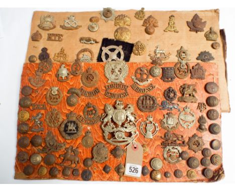 Two cards of various military badges, buttons, insignia, helmet plates etc, to include a helmet plate of the Cinq Ports Artil
