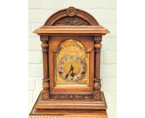 Edwardian chiming bracket clock with brass and silver dial in a walnut case. 88" tall, 12.5" wide 
