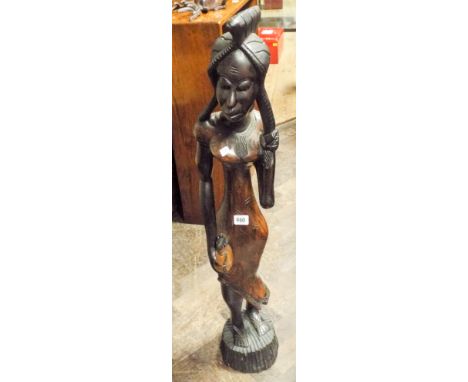 A 3' tall carved African figure of a tribal woman and a framed print of a ballerina 