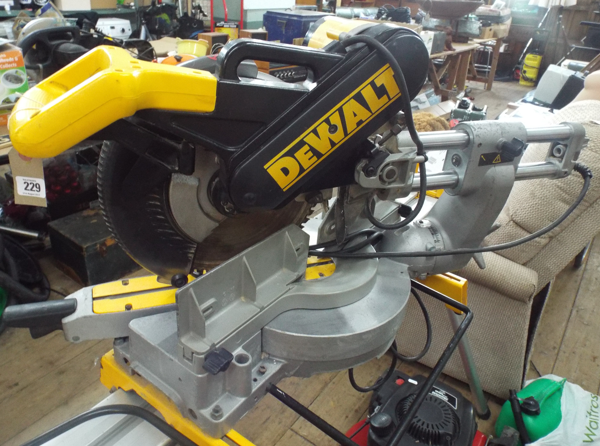 A 110v DeWalt DW708.LX mitre chop saw on a folding professional stand