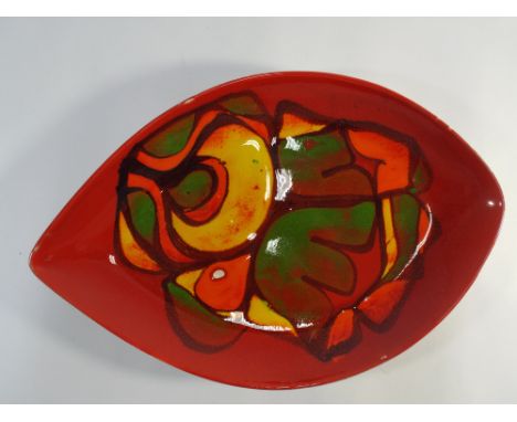 A Poole Pottery traditional Delphis plate with pallet of orange and green 
