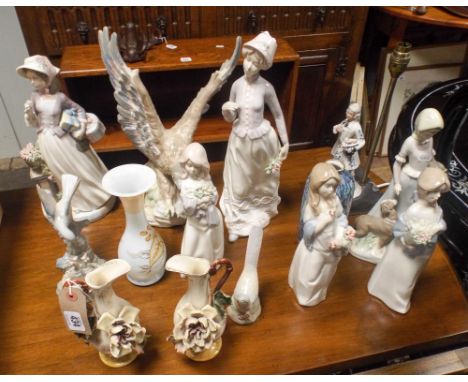 A collection of Lladro style figurines, vases, table lamp base etc