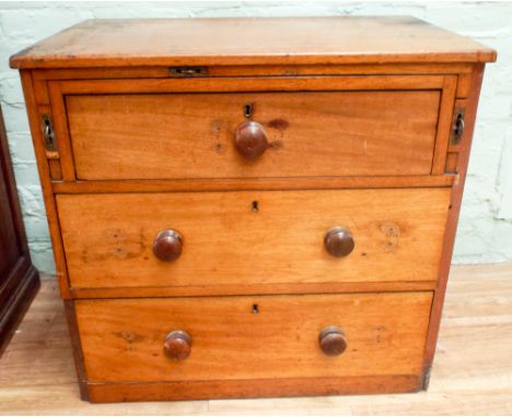A Victorian mahogany ships chest of 3 drawers with bun handles with pull out slide end supports with concealed brass ring han