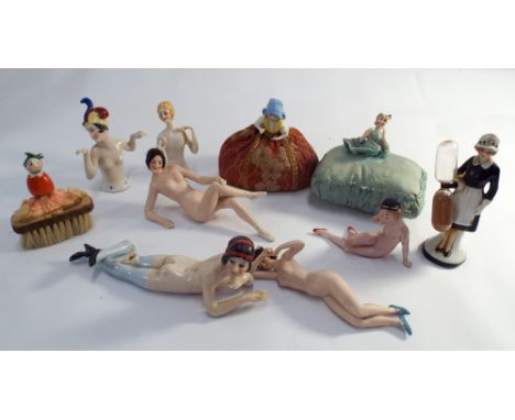 A collection of 10 Art Deco pin cushion half dolls, bisque ladies, egg timer etc     Arm has been glued back on to one of the