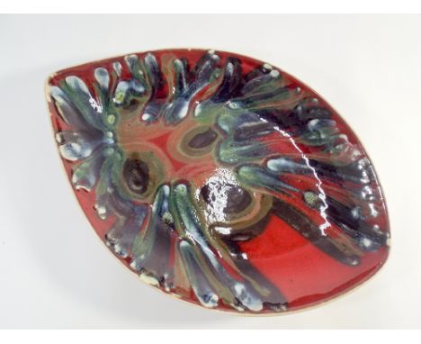 A Poole Pottery Delphis Studio leaf plate shape No 91 painted in dark red and moss green