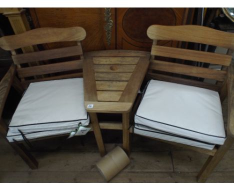 A heavy hardwood garden 2 seater bench with coffee table in centre