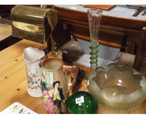 Brass desk lamp, iridescent glass bowl, tall vase, green glass float and a dolphin ornament 