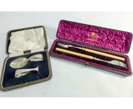 Two hallmarked silver pickle forks with ivory handles in a Mappin & Webb box and a sugar pusher and spoon set 