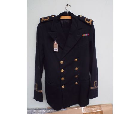 A Fleet Air Arms officers uniform complete with epaulets, peaked cap and leather flying helmet