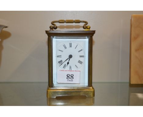 A glass cased carriage clock