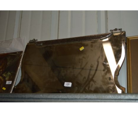An Art Deco unframed wall mirror