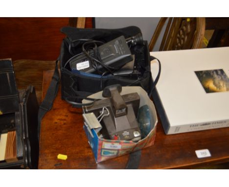 A camera; and a Panasonic video camera in carrying case