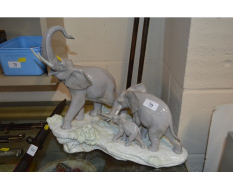 A large Lladro figure group in the form of three elephants 