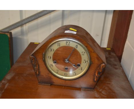A Westminster chime oak cased three hole mantel clock
