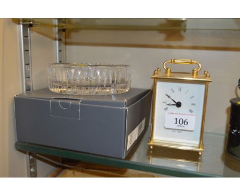 A modern brass cased mantel timepiece; and a Waterford crystal glass dish with original box 